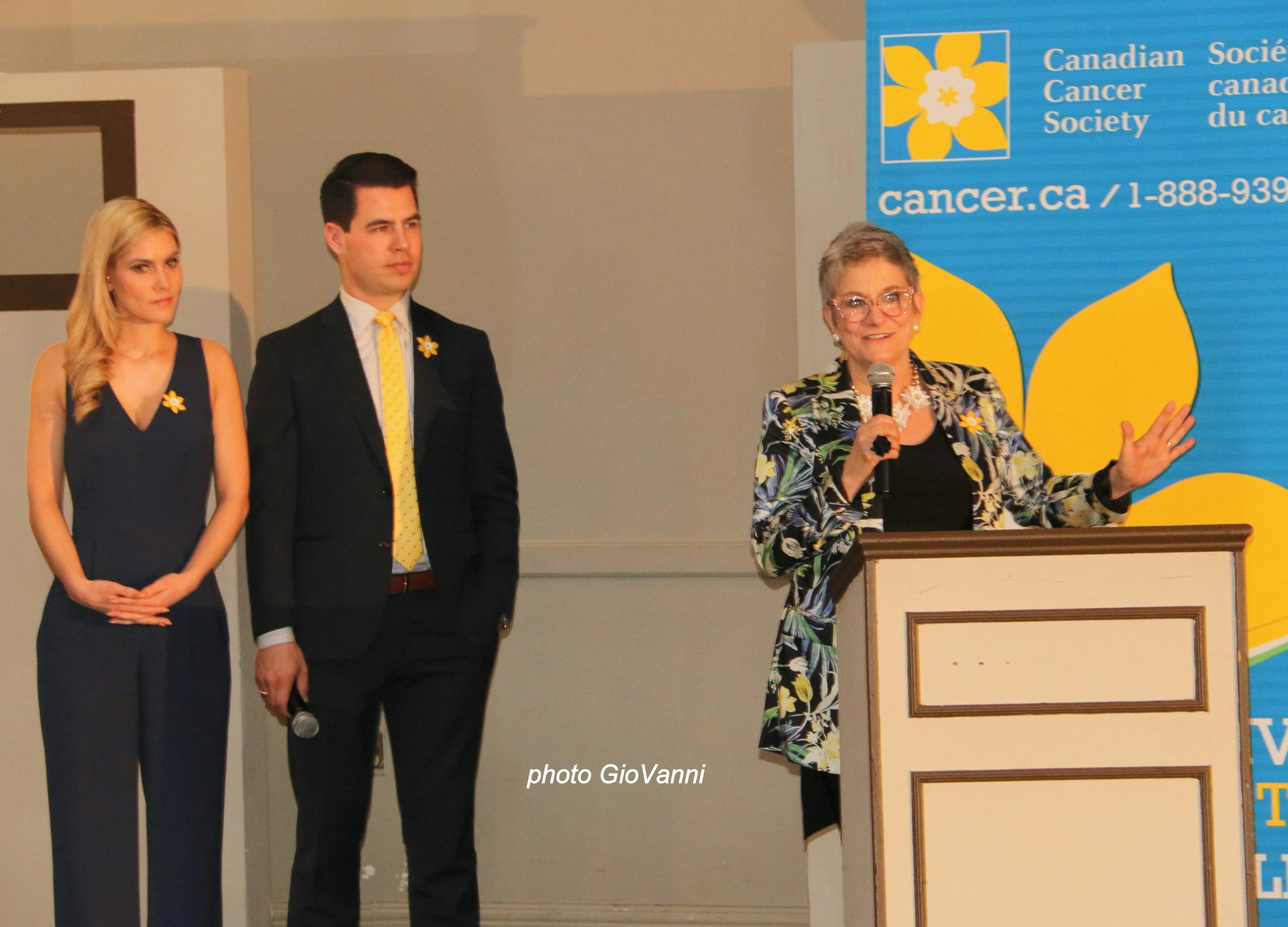 Gala speakers at podium with Canadian Cancer Society banner